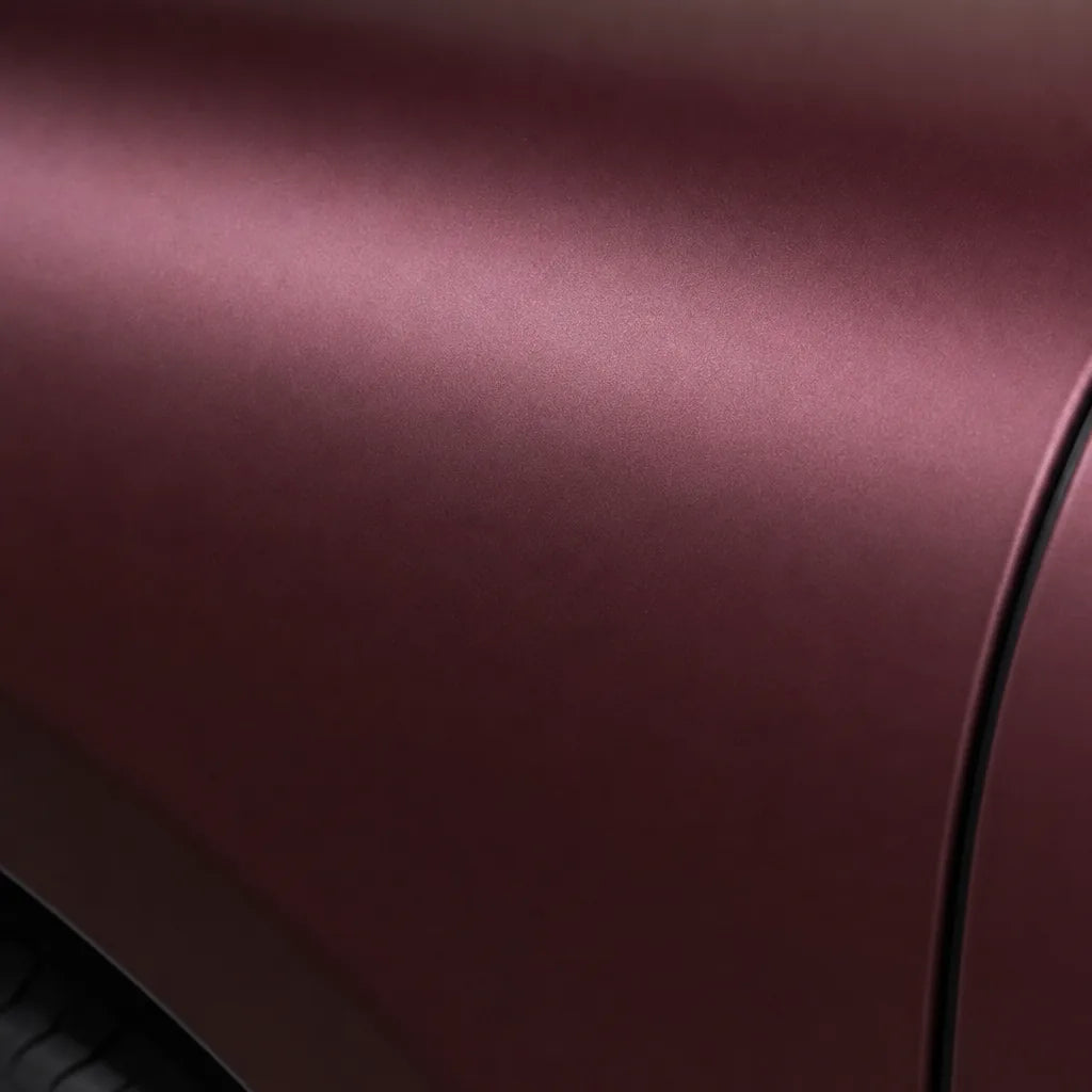 Close-up of Liquid Metallic Dracaena Red matte colored PPF surface texture | Veloro