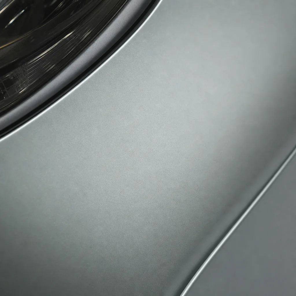 Close-up of Liquid Metallic Stellar Silver matte colored PPF surface texture | Veloro