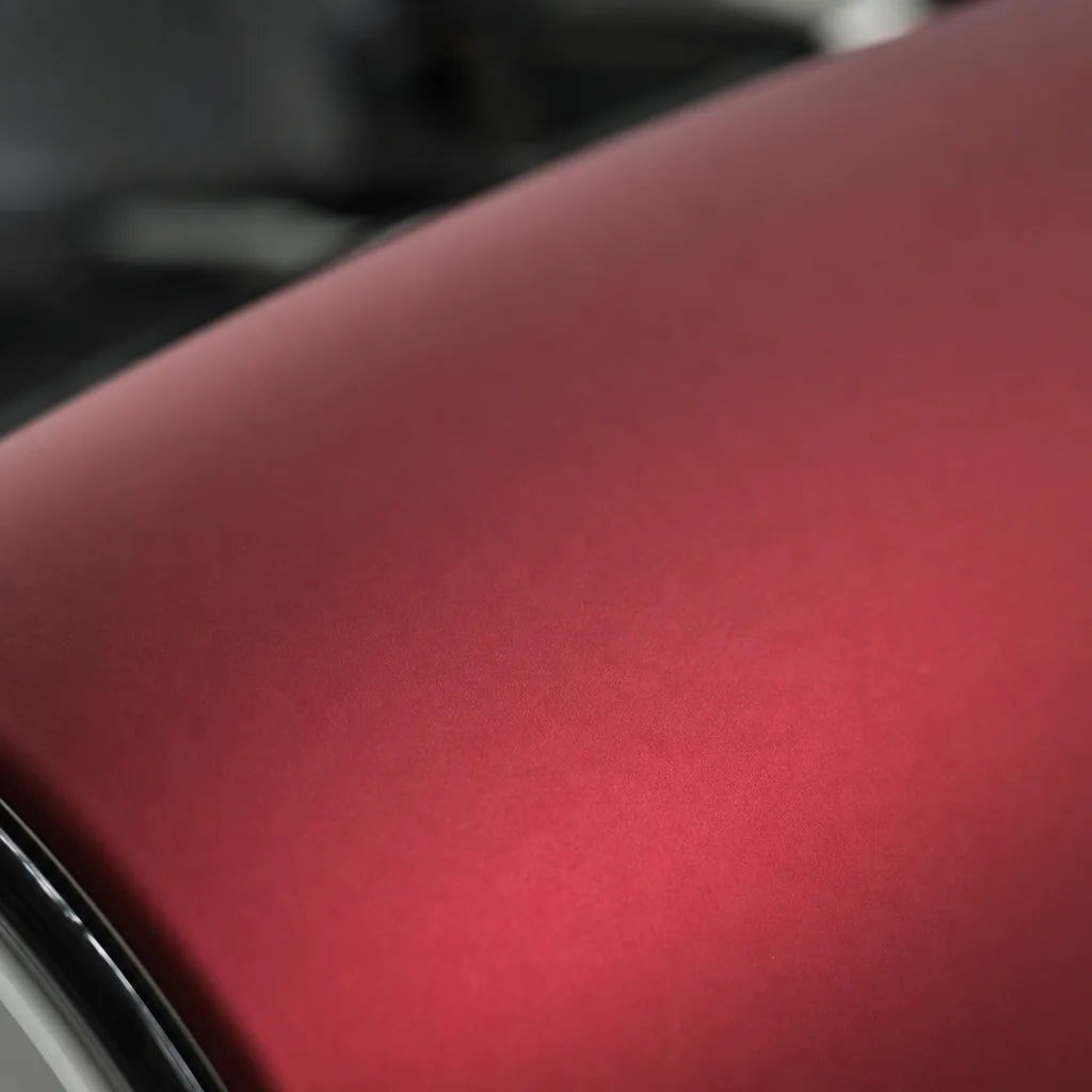 Close-up of Magic Flame Ruby Red matte colored PPF surface texture | Veloro