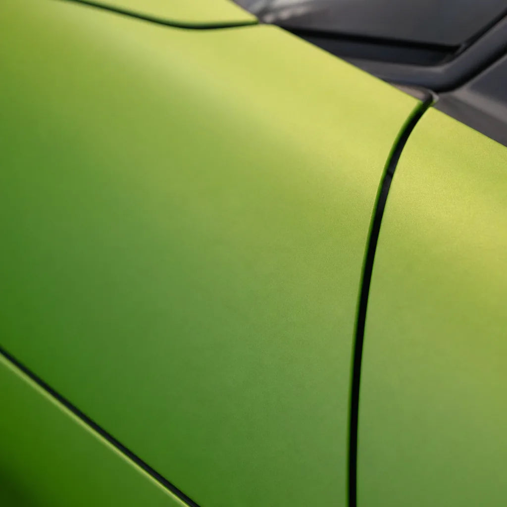 Close-up of Metallic STO Gold Green matte colored PPF surface texture | Veloro