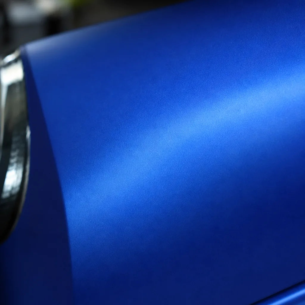 Close-up of Liquid Metallic Azure Blue satin colored PPF surface texture | Veloro