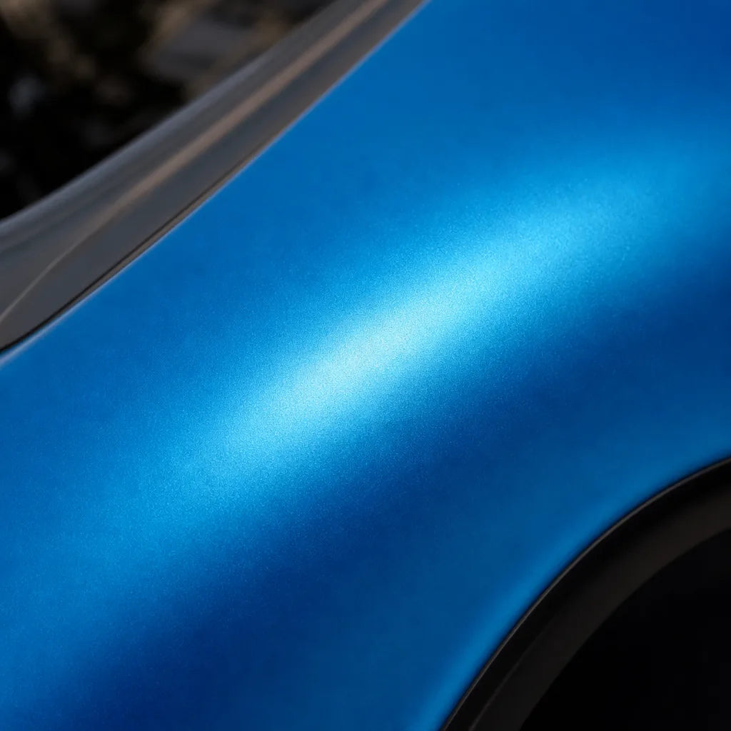 Close-up of Tunisian Blue satin colored PPF surface texture | Veloro