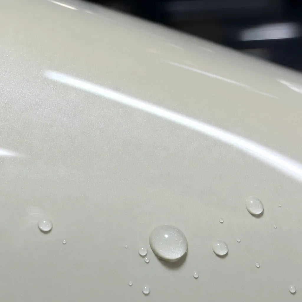 Close-up of Glossy Transparent Blue Diamond gloss colored PPF surface texture | Veloro