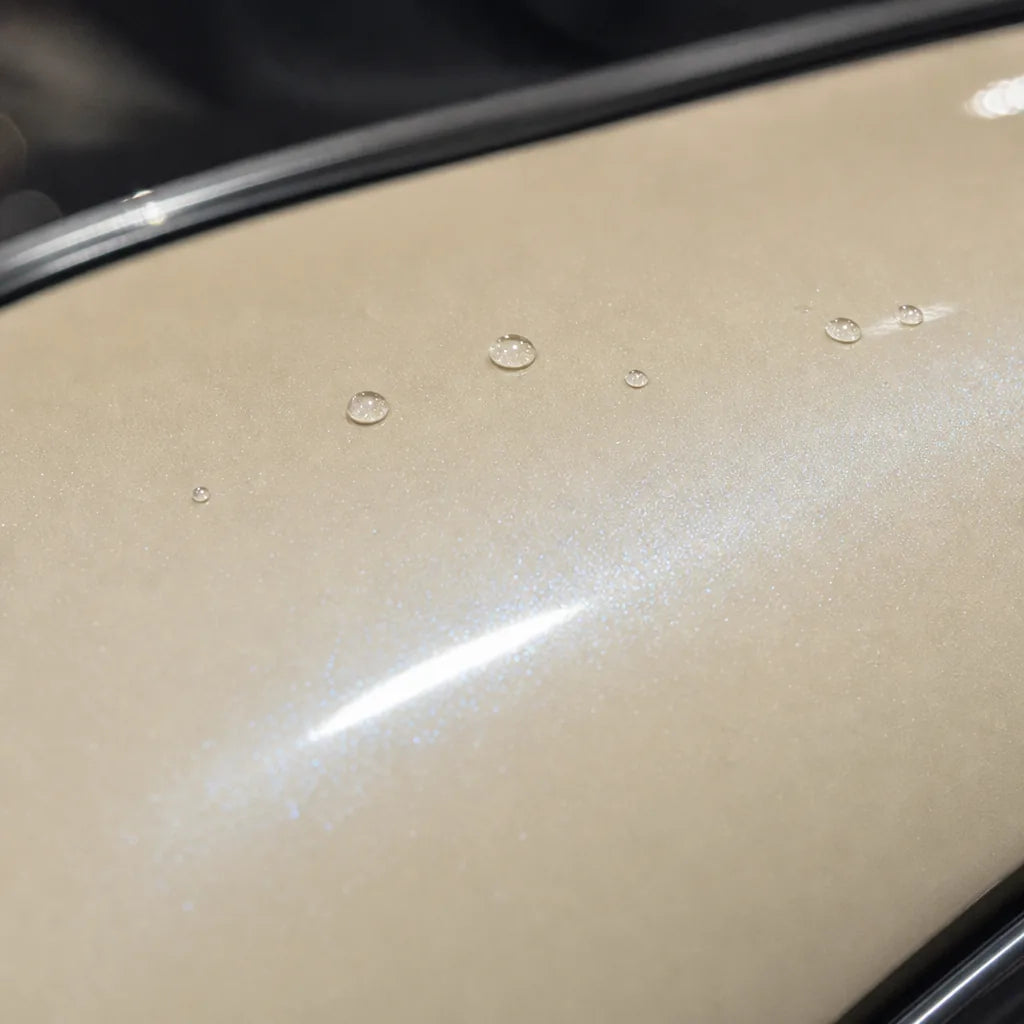 Close-up of Transparent Green Diamond gloss colored PPF surface texture | Veloro