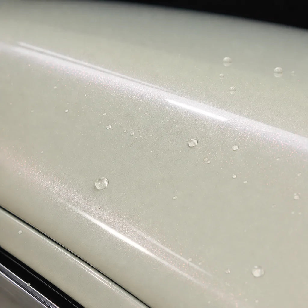 Close-up of Transparent Red Diamond gloss colored PPF surface texture | Veloro