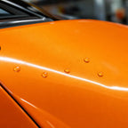 Close-up of Ultimate Flat Gold Orange gloss colored PPF surface texture | Veloro