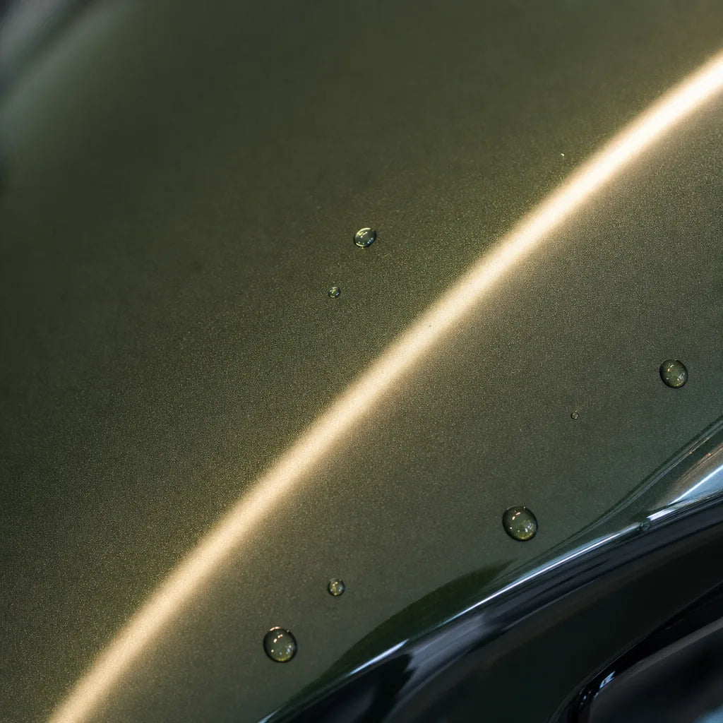 Close-up of Ultimate Flat Liquid Military Green gloss colored PPF surface texture | Veloro